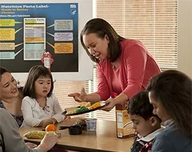 Teachers and students enjoying a meal